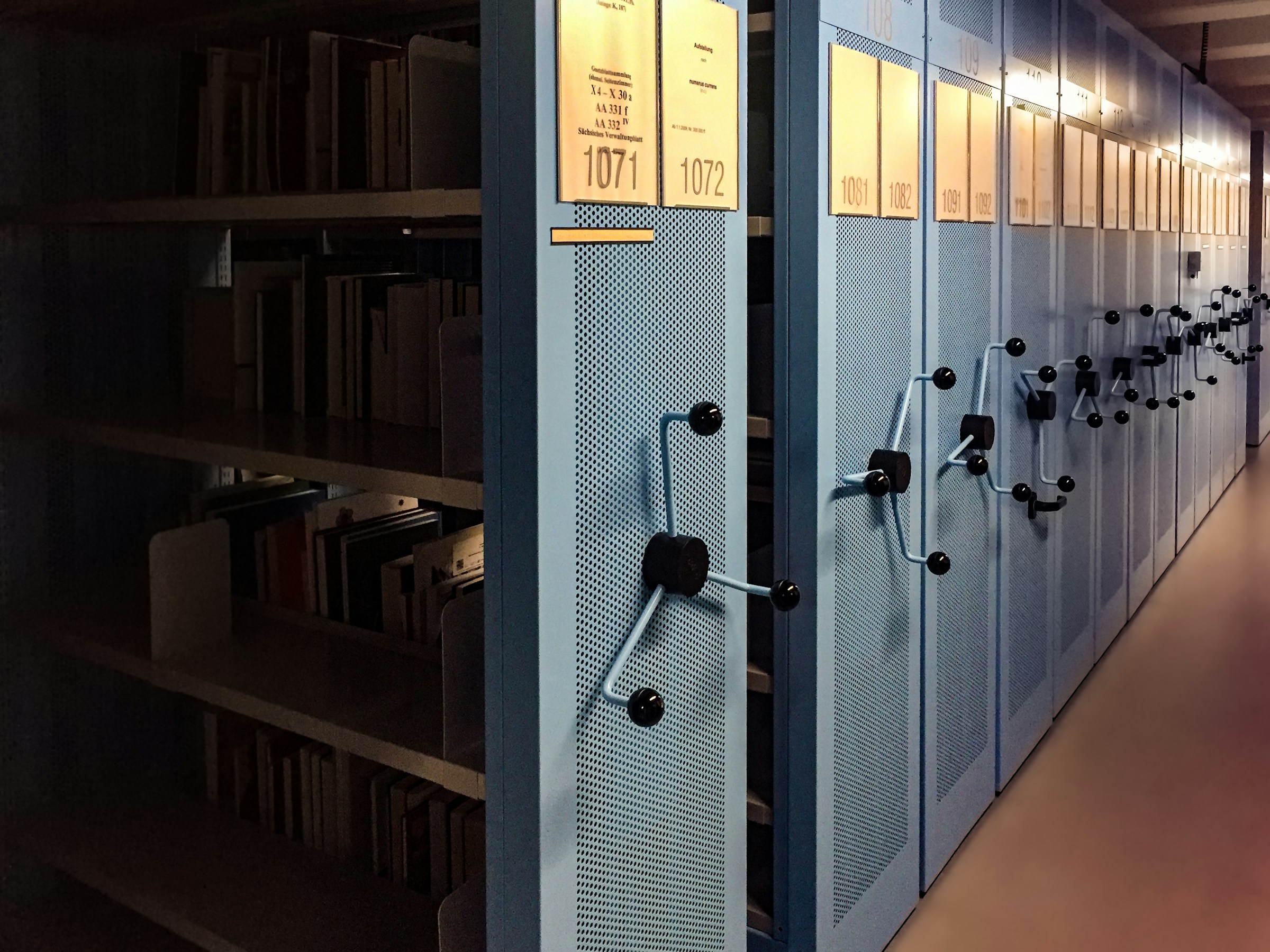 A row of archive cabinets containing corporate records and filings